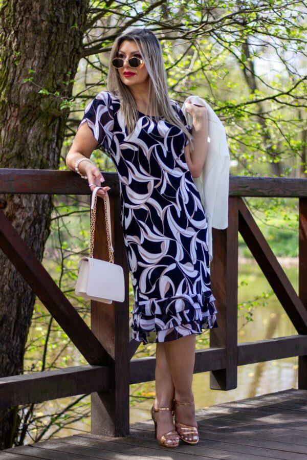 Letnia zwiewna koktajlowa sukienka w biało-beżowe wzory