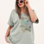 zielona bluzka z ażurowymi wstawkami