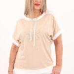 Bluzka ze sznurkami na dekolcie z kwiatem