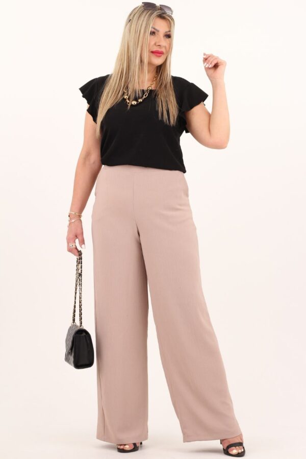 Beżowe spodnie damskie z szeroką nogawką